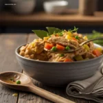 Close-up of a spoon lifting hearty Slow Cooker Chicken Stew
