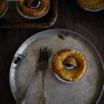 Creepy Eye Pies: 6 Must-Try Spooky Treats 5 A sliced Creepy Eye Pie on a stoneware plate
