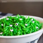 Halloween Monster Mac and Cheese: 5 Spooky Twists 5 Spoon lifting gooey Halloween Monster Mac and Cheese