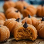 Stacked Pumpkin Cheesecake Truffles ready to be enjoyed.