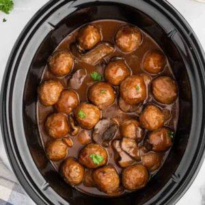 Slow Cooker Salisbury Steak Meatballs: 5 Easy Steps 7 Slow Cooker Salisbury Steak Meatballs on white marble, garnished