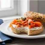 Appetizing smoked salmon bagel with everything seasoning