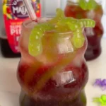 Witch's Potion Punch: How 3 Ingredients Make Magic 4 Closeup of Witchs Potion Punch being poured into a goblet