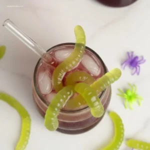 Witch's Potion Punch: How 3 Ingredients Make Magic 5 Vibrant green Witchs Potion Punch in a pitcher with spooky garnishes