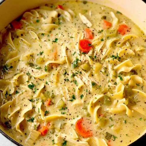 Creamy Chicken Noodle Soup: 3 Easy Recipes 2 A steaming bowl of creamy chicken noodle soup garnished with fresh parsley