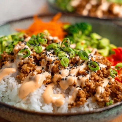 Ground Turkey Rice Bowls with Bang Bang Sauce 2 Ground Turkey Rice Bowls with Bang Bang Sauce served in a colorful bowl