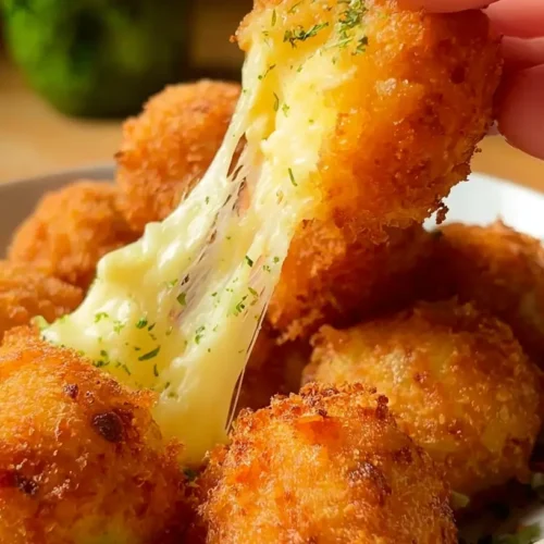 Potato Cheese Balls: Your 2 Go-To Comfort Food Recipes 2 A close-up of golden-brown potato cheese balls on a serving plate.