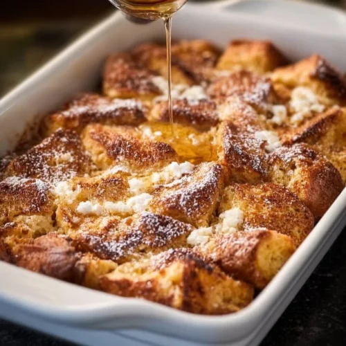 Traditional French Toast Casserole 2 Traditional French Toast Casserole with syrup and berries on a plate