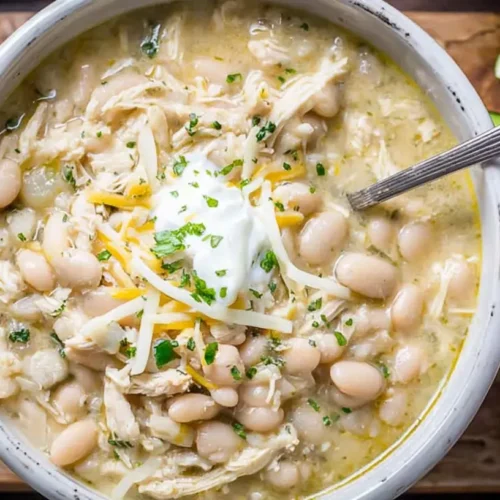 White Chicken Chili Slow Cooker: 4 Delicious Dinners 2 A hearty bowl of white chicken chili cooked in a slow cooker, ready to serve.