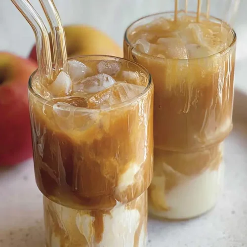Apple Iced Coffee: 3 Recipes You Need to Try 2 A tall glass of apple iced coffee with ice cubes