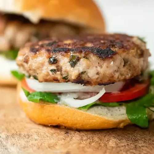 Best Turkey Burger Recipe: How Many Calories? 2 A delicious turkey burger patty, perfectly seared on a grill