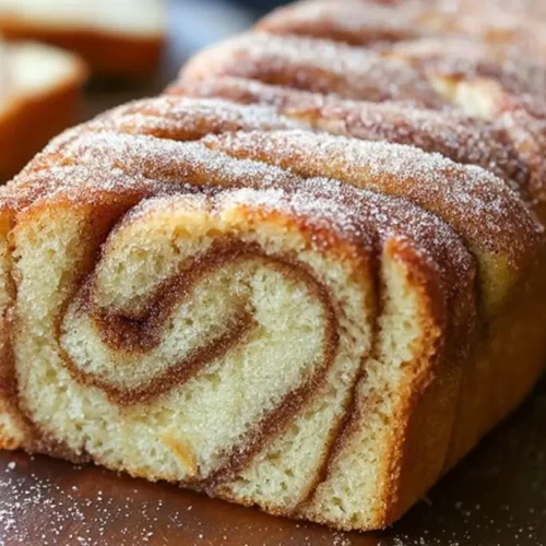 Cinnamon Donut Bread: Why You Need 1 Now 2 A freshly baked cinnamon donut bread, golden brown and glistening