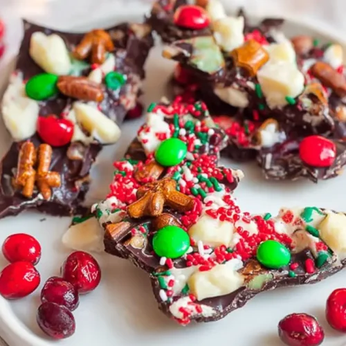 Festive Christmas Bark: 4 reasons it's a must-have 2 A close-up of colorful and festive Christmas bark, adorned with sprinkles and candies.