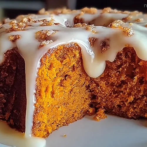 A delectable sweet potato honeybun cake with a golden glaze.