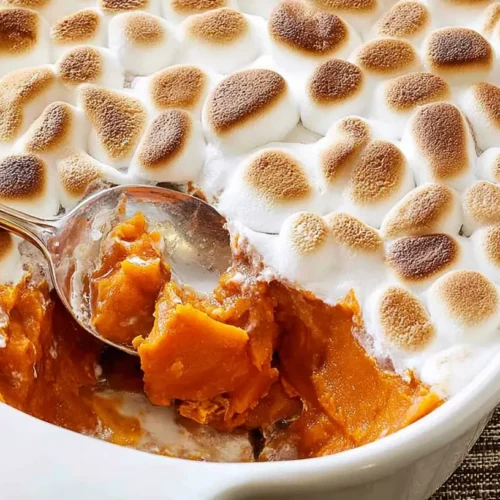 Sweet Potatoes with Marshmallows: 7 Top Tips 2 Sweet potatoes with melted marshmallows in a baking dish