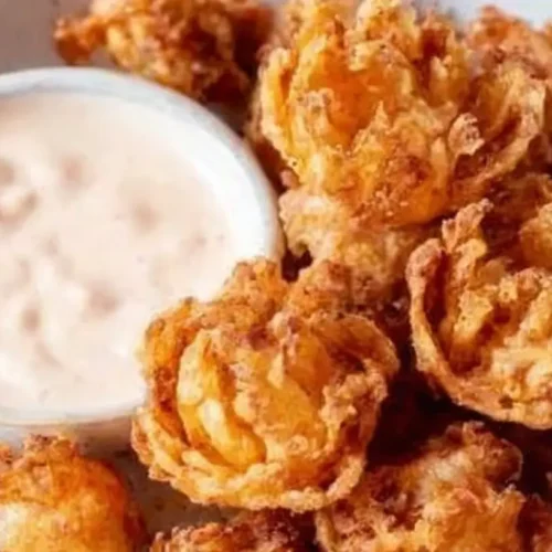 Close-up of bite-sized blooming onions with buttermilk ranch dip