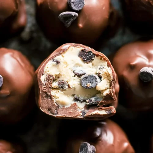 Chocolate Chip Cookie Dough Truffles: 7 Sweet Ideas 2 A close-up shot of decadent chocolate chip cookie dough truffles, sprinkled with chocolate shavings.