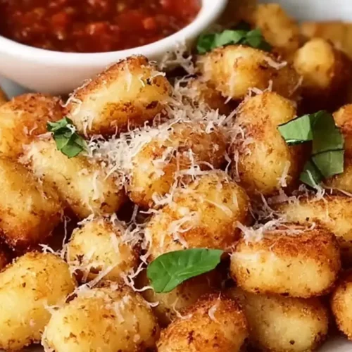 A close-up of crispiest air fryer gnocchi, golden brown and perfectly cooked.