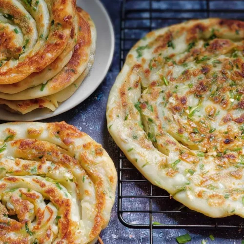 Crispy Chinese Scallion Pancakes (Cong You Bing): 5 Easy Steps 2 A close-up of crispy Chinese scallion pancakes with golden-brown edges.