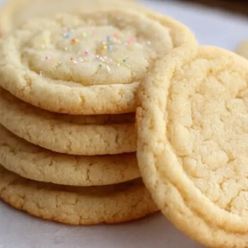 Easy Sugar Cookies: Top 6 Ways to Enjoy Them 2 A freshly baked batch of easy sugar cookies on a cooling rack.