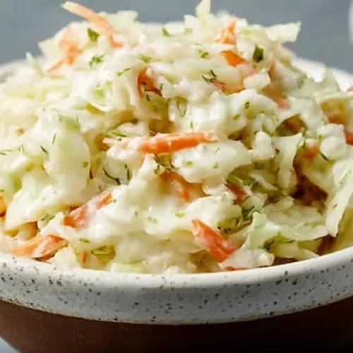 A serving of the famous KFC Coleslaw classic in a white bowl