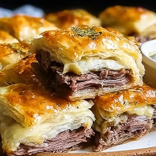 A tray of golden-baked French Dip Squares, ready to serve