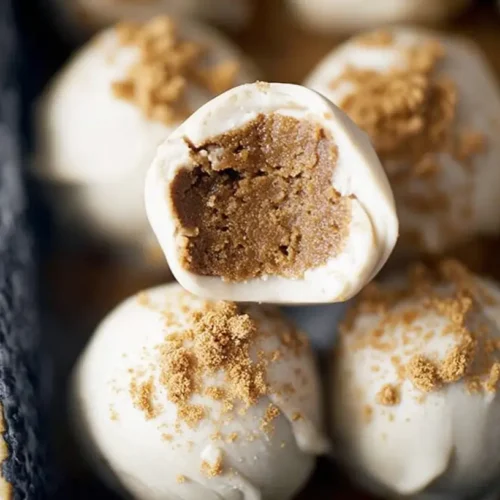 A close-up of delicious gingerbread truffles, perfectly round and coated.