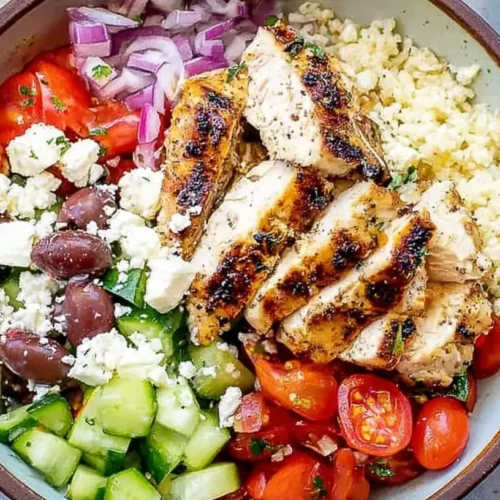 Greek Chicken Bowls: The 8 Best Protein-Packed 2 A vibrant Greek chicken bowl with fresh vegetables and feta cheese
