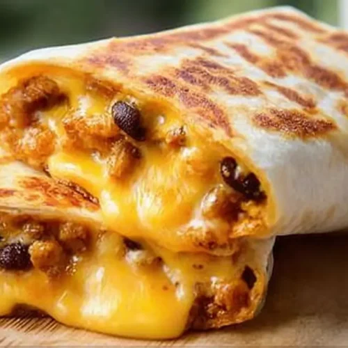 Grilled Cheese Burrito: Your 2-Minute Guide 2 A mouthwatering grilled cheese burrito showing melted cheese inside.