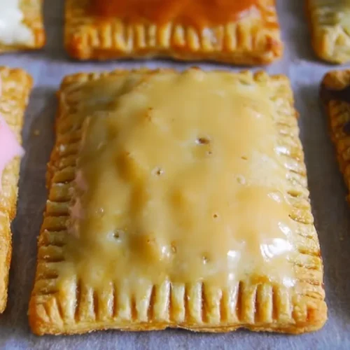Homemade Pop Tarts: Why 1 Million Love Them 2 Homemade Pop Tarts with a flaky crust and fruit filling.