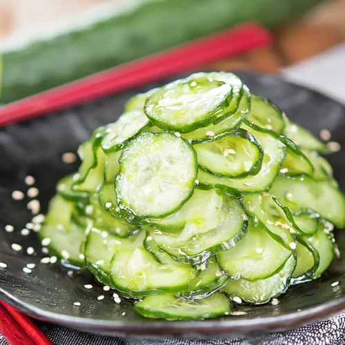 Japanese Cucumber Salad (Sunomono): How 2 Make it Healthier 2 A refreshing Japanese cucumber salad, known as Sunomono, in a bowl.
