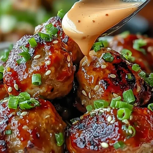 Delicious Korean BBQ meatballs served with a dollop of spicy mayo.