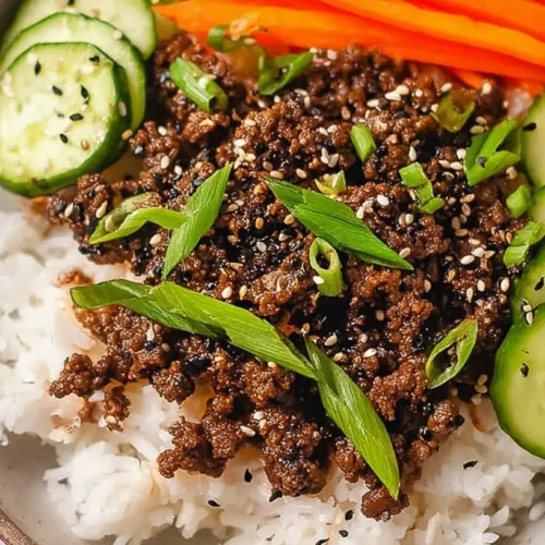 Korean Ground Beef Bowl: Why 1 Dinner Works 2 A delicious Korean Ground Beef Bowl topped with fresh green onions and sesame seeds, served in a ceramic bowl.
