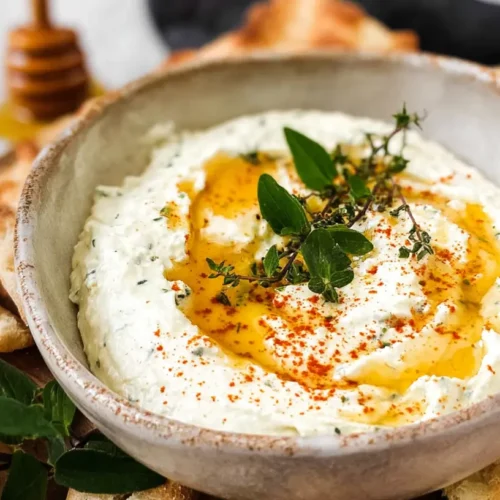Ricotta Dip with Hot Honey: 7 Reasons to Try It 2 A creamy ricotta dip drizzled generously with hot honey, served in a ceramic bowl.