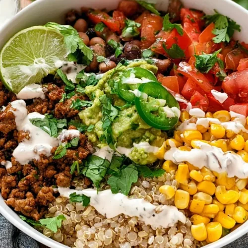 A vibrant taco rice bowl overflowing with fresh ingredients