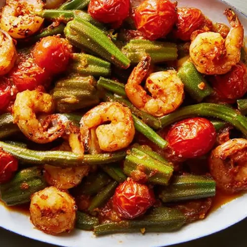 Smothered Okra with Shrimp and Tomatoes: 5 Reasons to Try It 2 A close-up of Smothered Okra with Shrimp and Tomatoes in a rustic bowl.