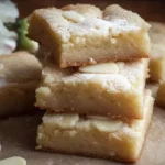 Freshly baked white chocolate brownies cooling on a wire rack