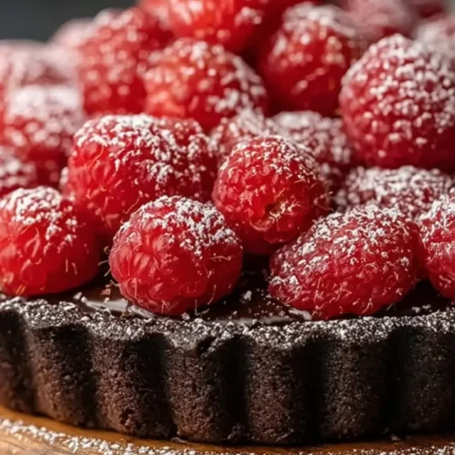 Easy Chocolate Raspberry Tart: 10/10 Delicious & Simple 2 An easy chocolate raspberry tart with fresh berries on top