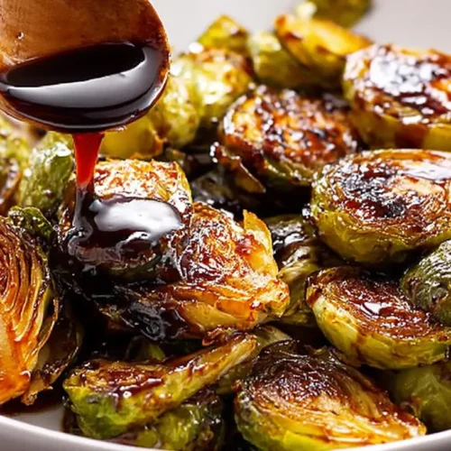Maple Balsamic Chicken with Brussels Sprouts — sweet glaze + crisp veg.: 2 easy steps 2 Maple Balsamic Chicken with crispy Brussels sprouts, artfully plated with a sweet glaze.