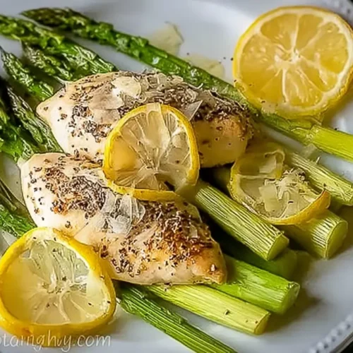 Sheet Pan Lemon Pepper Chicken & Asparagus — crisp edges, zesty finish. 5 Reasons to Love It! 2 A full sheet pan of lemon pepper chicken and asparagus with crisp edges