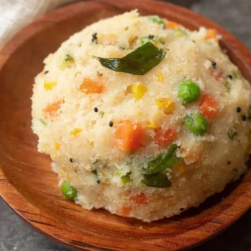 Vegetable Upma: How 2 Simple Spices Elevate Flavor 2 A bowl of freshly cooked vegetable upma, rich with colorful veggies