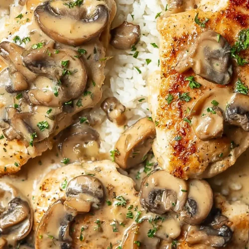 Creamy Mushroom Chicken Dinner: 3 Easy Steps to Yum 2 A close-up of a creamy mushroom chicken dinner served in a skillet.