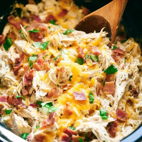 Crockpot Chicken Casserole: How to Feed 6 People Easily 2 A bubbling crockpot chicken casserole in a slow cooker.