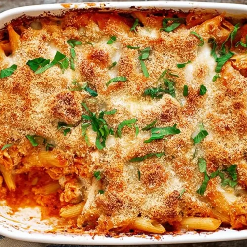 A saucy, cheesy dump-and-bake chicken parmesan pasta casserole, freshly baked.