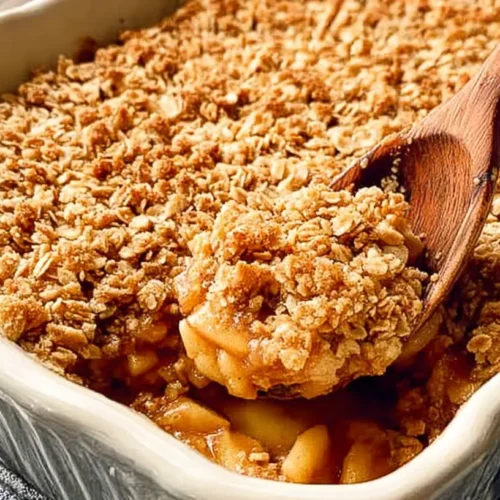 Easy Apple Crisp Dessert: How 9 Bakers Do It Best 2 A freshly baked easy apple crisp dessert in a ceramic dish, steam rising.