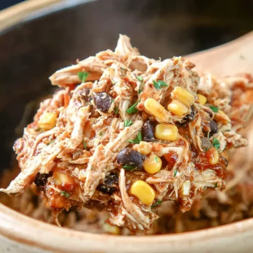Easy Crockpot Shredded Chicken: 8 Ways to Serve 2 A bowl of easy crockpot shredded chicken, ready to serve.