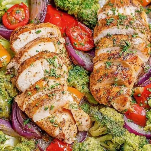 A healthy dinner recipe featuring chicken and a colorful assortment of vegetables.