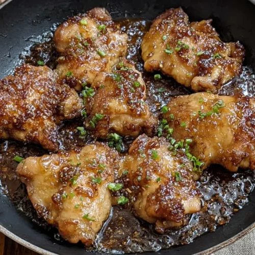 Honey Garlic Chicken Thighs: 10 Minute Meal Magic! 2 A close-up of perfectly glazed honey garlic chicken thighs