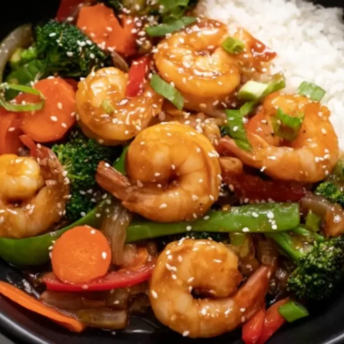 Simple Shrimp Stir-Fry Dinner: 2 Quick Tips Inside. 2 A vibrant simple shrimp stir-fry dinner with mixed vegetables and noodles.
