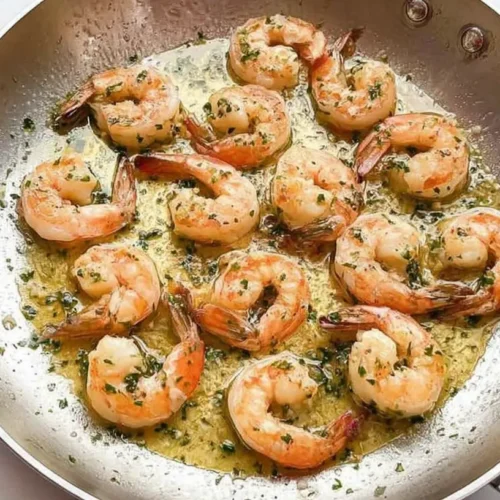 Easy Garlic Butter Shrimp: How to Make It in 1 Step 2 A serving of easy garlic butter shrimp in a skillet, ready to eat